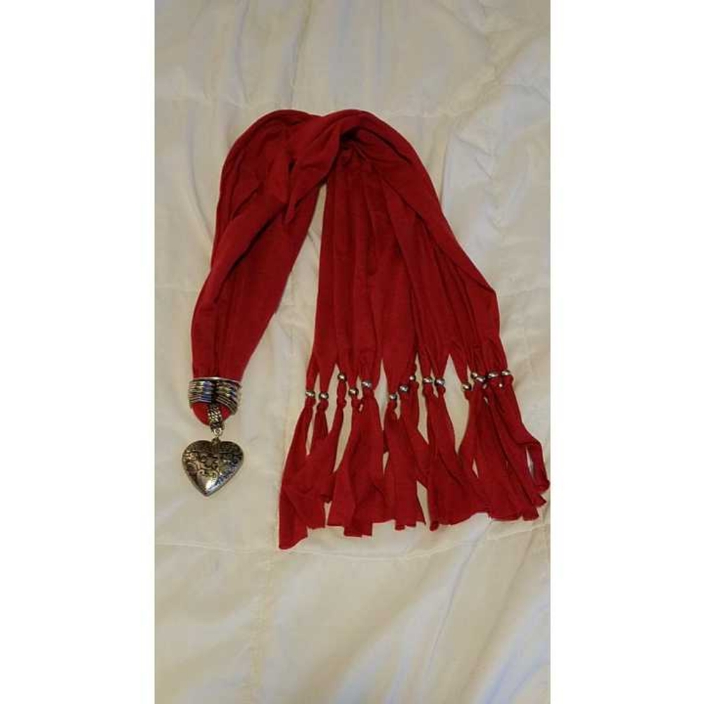 Red scarf with silver heart pendant